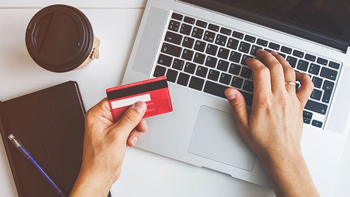 man entering credit card details 