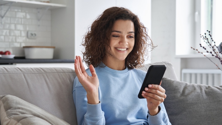 girl sitting and using smartphone app