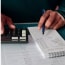 man calculating household expenses with a calculator