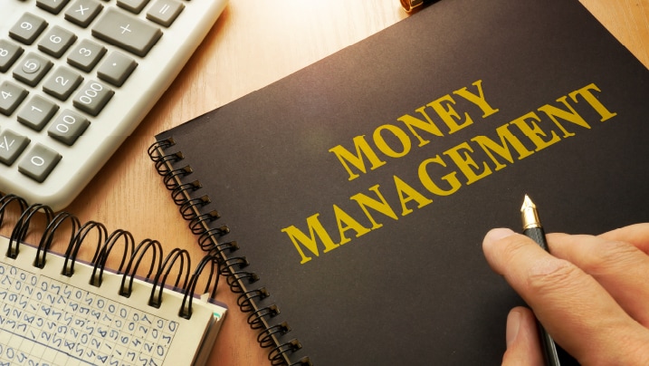 Book with money management on a table.