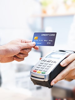 a person performing a credit card transaction